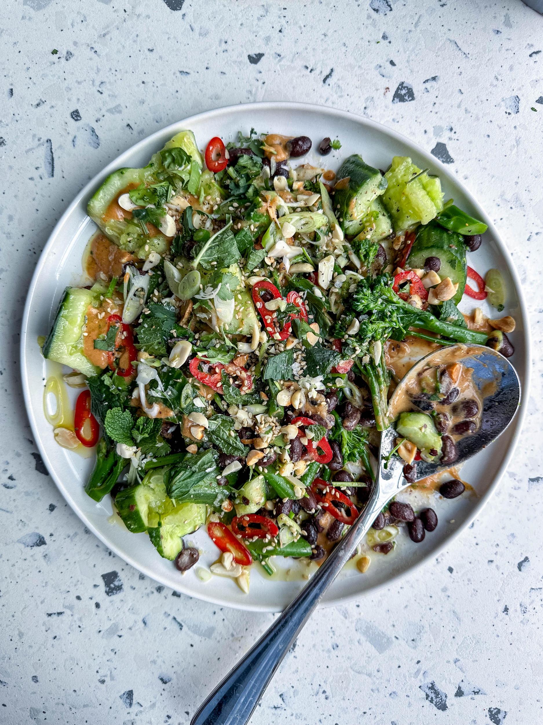 Image of Smacked Cucumber Salad With Black Beans, Broccoli, and Satay Dressing